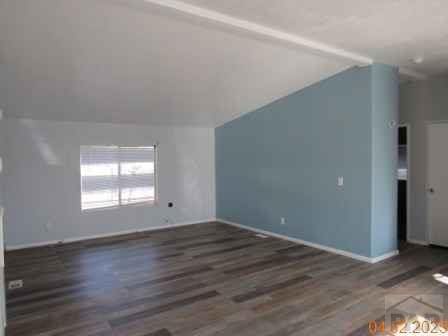 326 Katherine St, Avondale, CO 81022 - bonus room with vaulted ceiling and wood finished floors