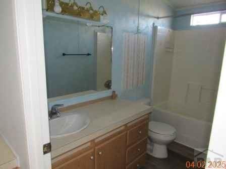 326 Katherine St, Avondale, CO 81022 - full bathroom with vanity, toilet, and tub / shower combination