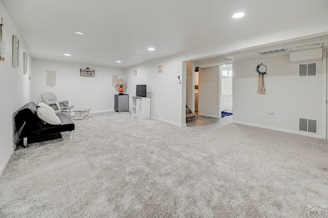 unfurnished room with carpet floors, visible vents, and stairway