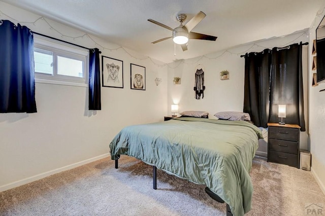 bedroom featuring carpet, baseboards, and ceiling fan