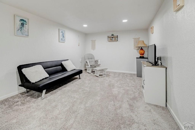 sitting room with carpet floors, recessed lighting, and baseboards