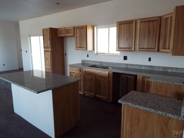 kitchen with a kitchen island and brown cabinets