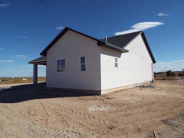 view of property exterior with stucco siding