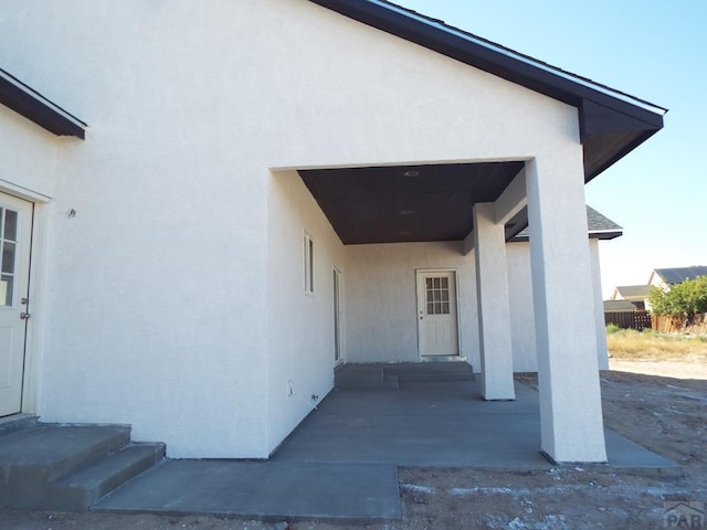 view of property exterior featuring entry steps and stucco siding