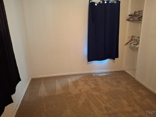 209 5th St, Fowler, CO 81039 - carpeted empty room featuring baseboards