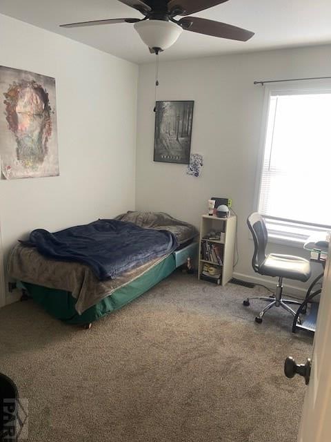 bedroom with carpet and a ceiling fan