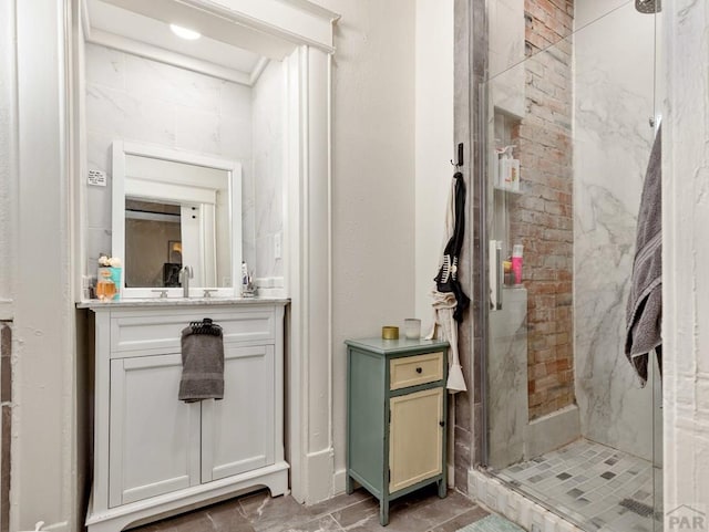 full bathroom featuring a shower stall and vanity