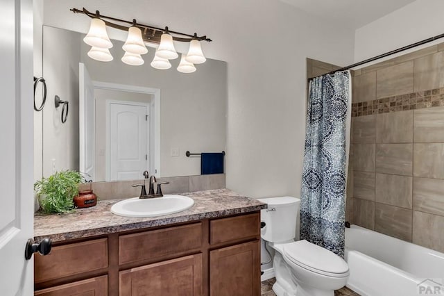 full bathroom with shower / tub combo with curtain, vanity, and toilet