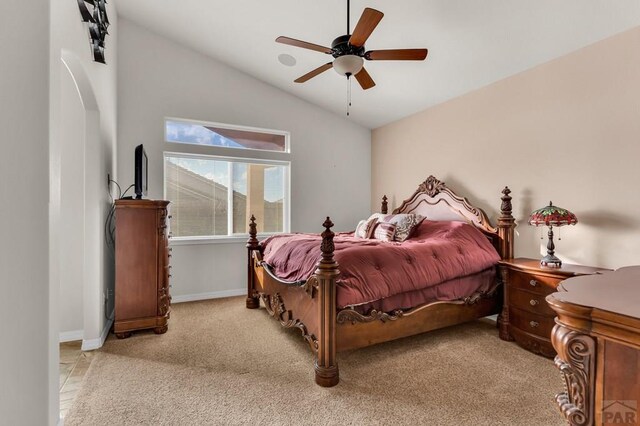 bedroom featuring lofted ceiling, carpet floors, ceiling fan, and baseboards