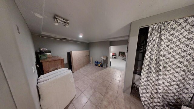 bedroom with light tile patterned floors