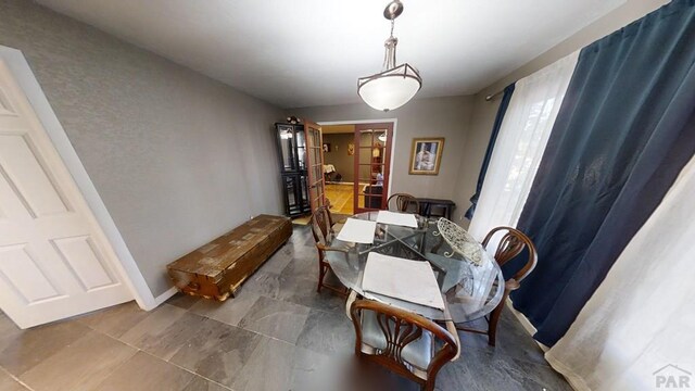 dining room featuring baseboards