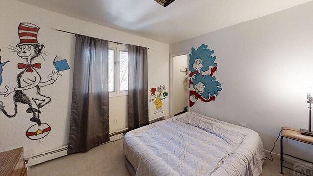 bedroom featuring a baseboard radiator and light colored carpet