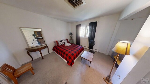 carpeted bedroom featuring visible vents and baseboards