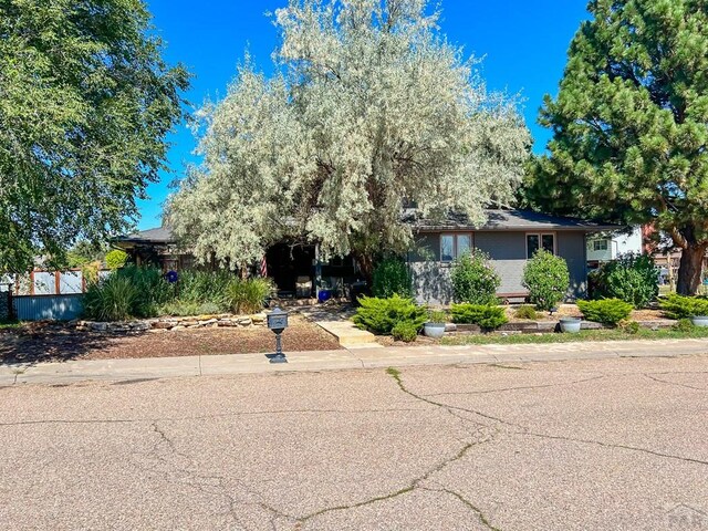 view of front of property featuring fence