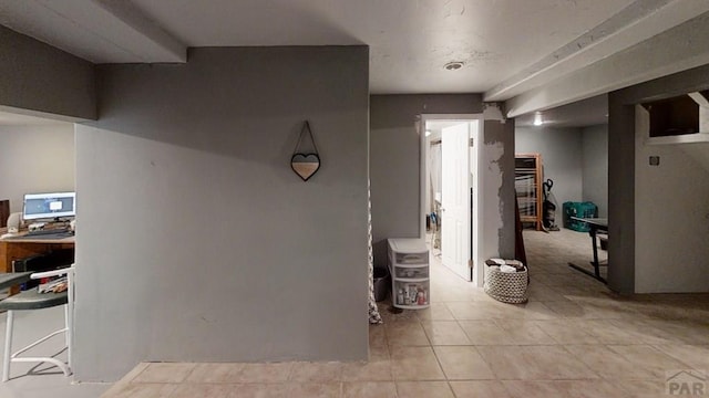 hallway featuring light tile patterned floors