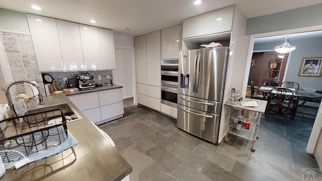 kitchen featuring decorative light fixtures, white cabinets, stainless steel refrigerator with ice dispenser, and modern cabinets