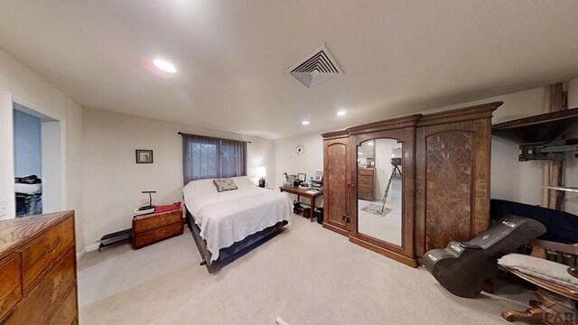 bedroom with recessed lighting, visible vents, light carpet, and baseboards