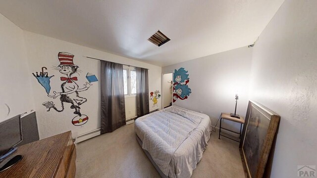 bedroom with a baseboard heating unit and light colored carpet