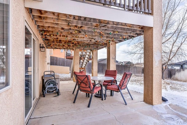 view of patio / terrace with outdoor dining area, a fenced backyard, and a pergola