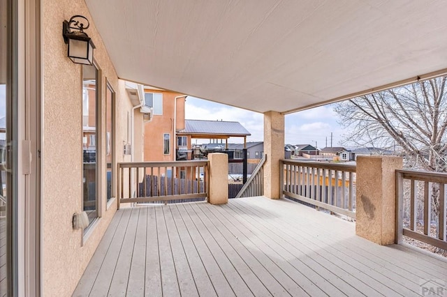 wooden terrace with a residential view