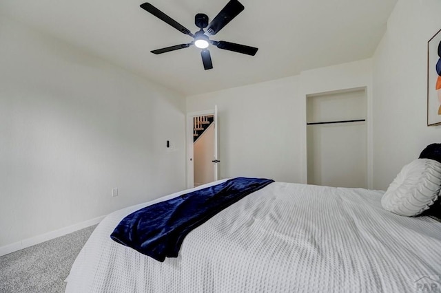 bedroom with carpet floors, ceiling fan, and baseboards