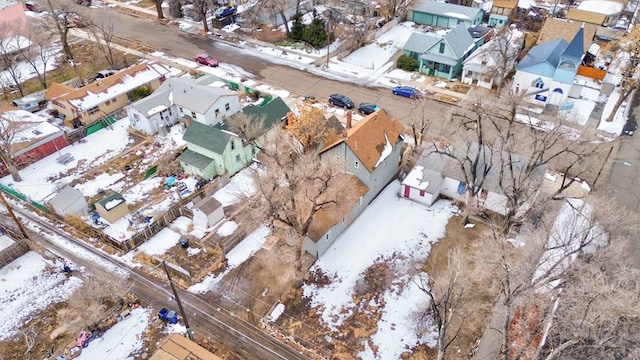 snowy aerial view with a residential view