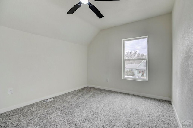 bonus room with carpet floors, lofted ceiling, visible vents, ceiling fan, and baseboards