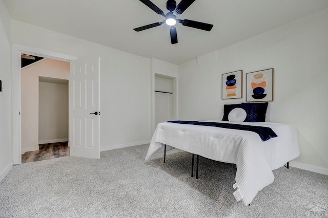 interior space featuring carpet flooring, a ceiling fan, and baseboards