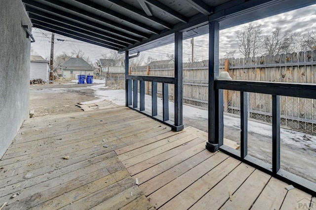 wooden terrace featuring a fenced backyard