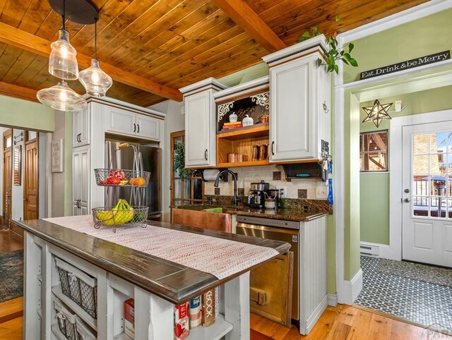 kitchen with open shelves, stainless steel appliances, and white cabinets