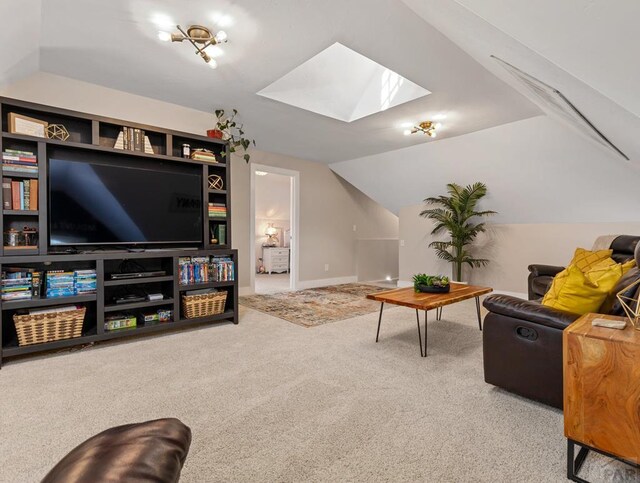 living room with carpet floors, baseboards, and lofted ceiling with skylight