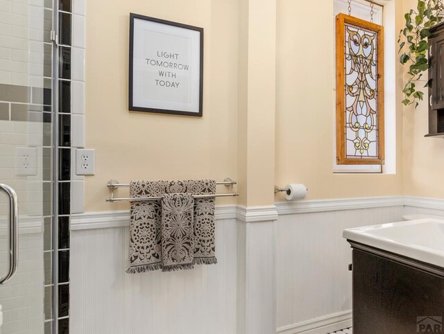 full bath featuring a wainscoted wall