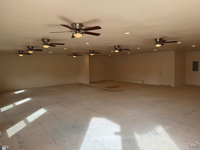 spare room featuring electric panel and recessed lighting