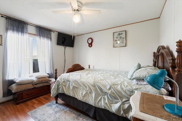 bedroom featuring ceiling fan and wood finished floors