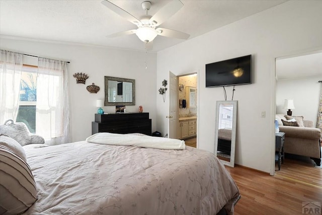 bedroom with ceiling fan and wood finished floors