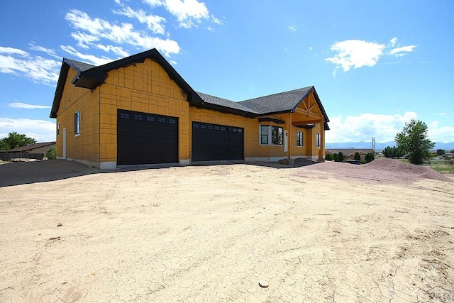 view of front facade with driveway and an attached garage