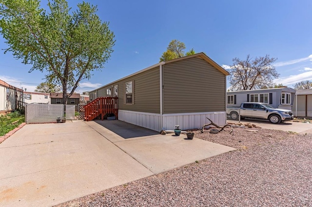 view of side of property with fence