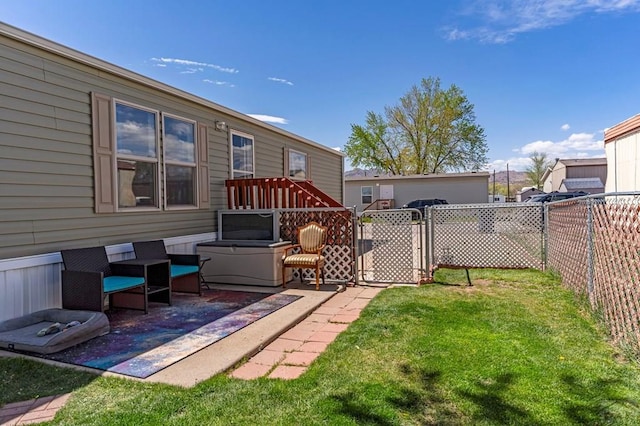 view of yard featuring a fenced backyard, a gate, and a patio area