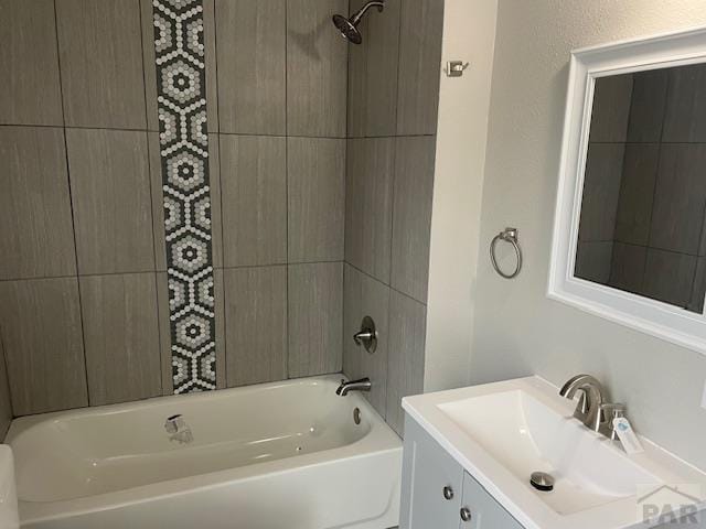 bathroom featuring vanity and shower / tub combination