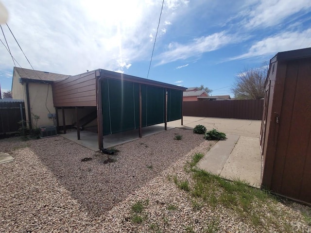 view of outbuilding with fence