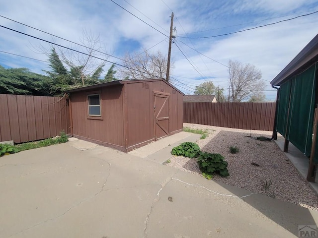 view of shed featuring a fenced backyard