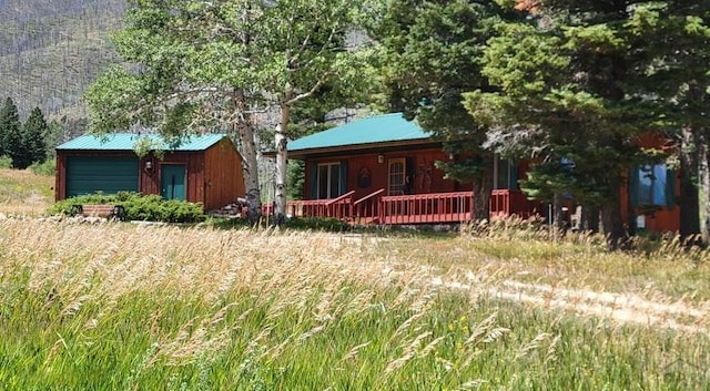 rustic home with an outbuilding