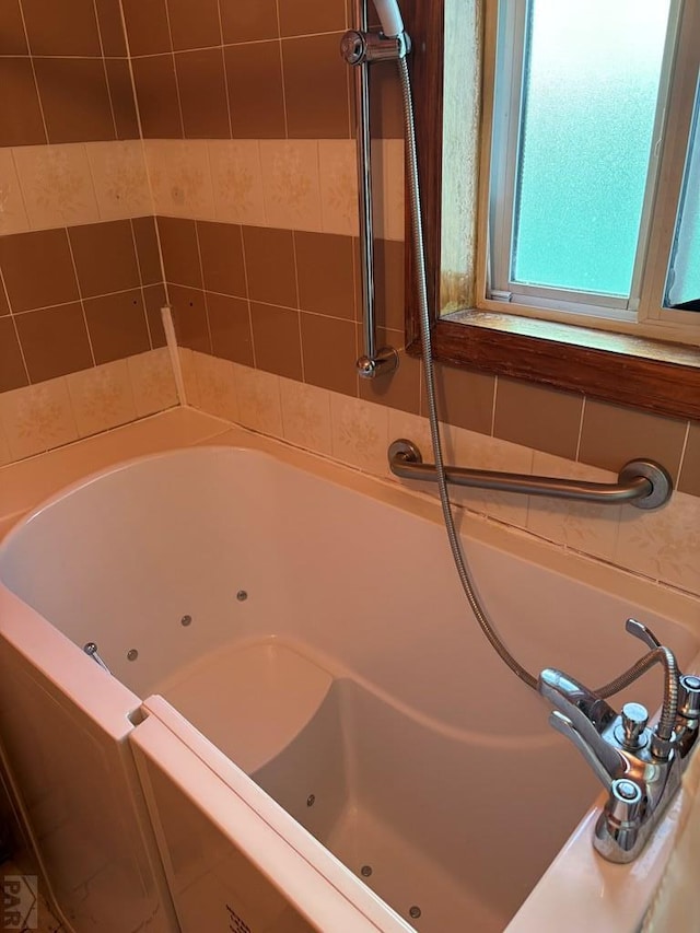 bathroom featuring a jetted tub