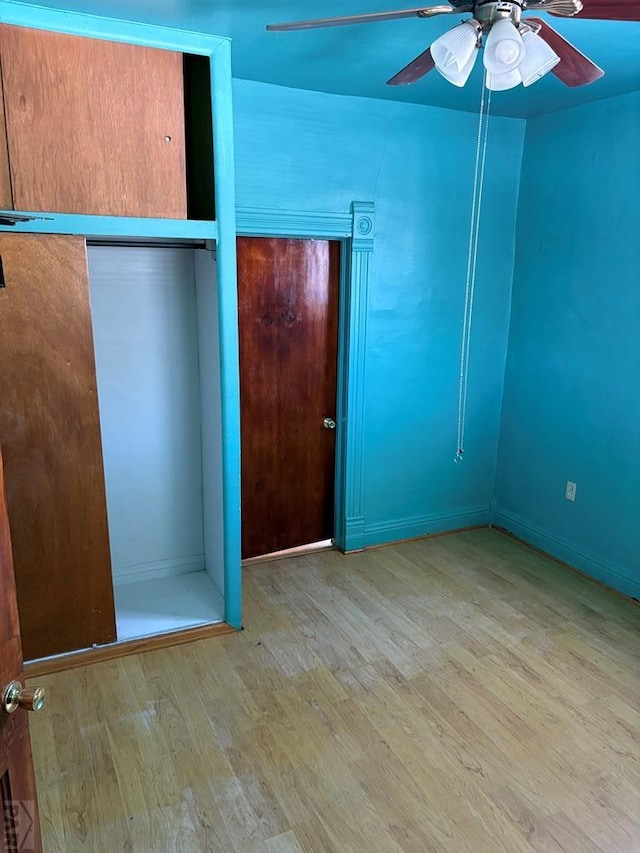 unfurnished bedroom featuring light wood-style floors and ceiling fan