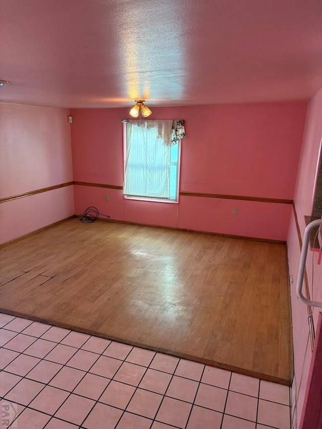 unfurnished room with light wood-type flooring