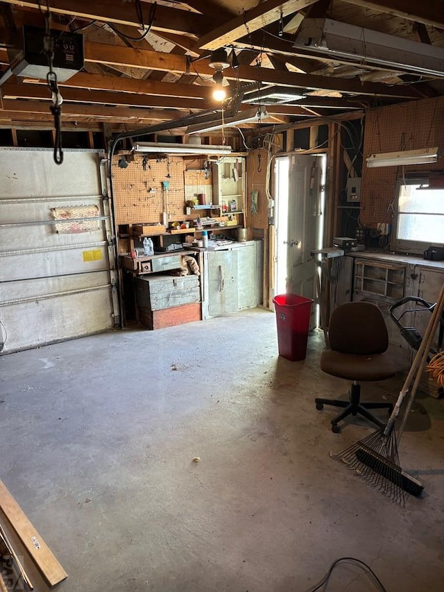 garage featuring a workshop area and a garage door opener