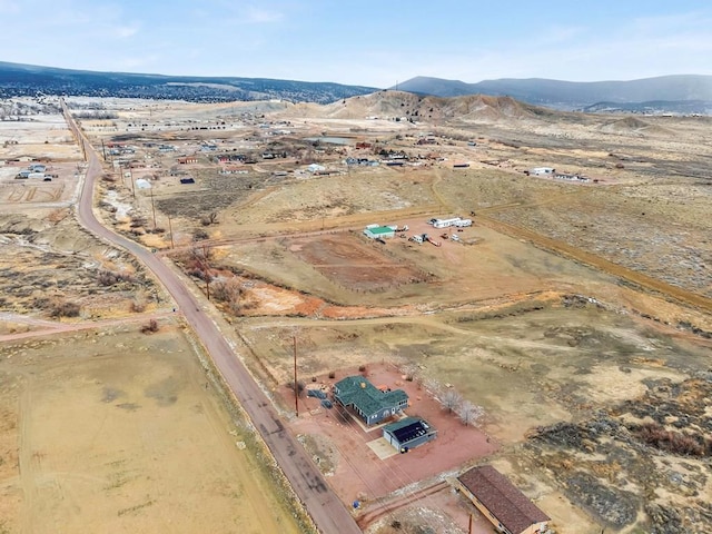 birds eye view of property with a mountain view