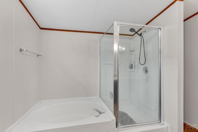 full bath featuring a shower stall, a garden tub, and crown molding