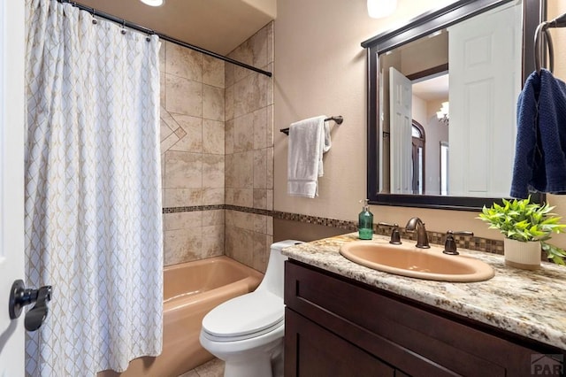 full bathroom featuring shower / tub combo, vanity, and toilet