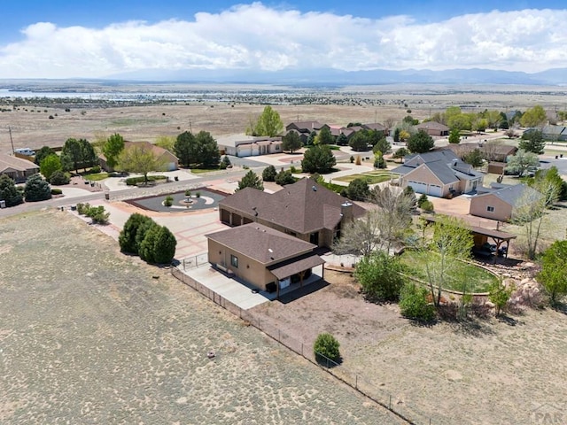 birds eye view of property featuring a mountain view and a residential view